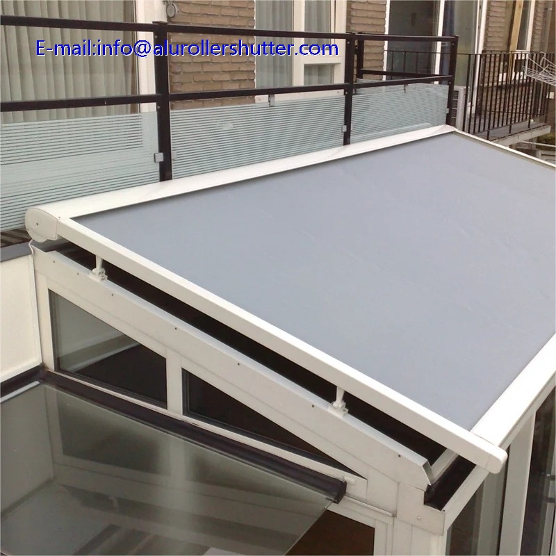 Motorized retractable roof mounted awning