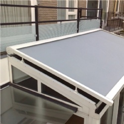 Motorized retractable roof mounted awning